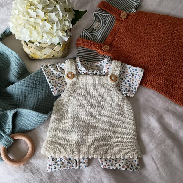 Baby dress pinafore with picot edging in cream and rust colours
